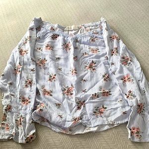 Off the shoulder long sleeve shirt.